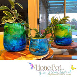 artisan designed plant pots in fluorescent green, aqua and blues 